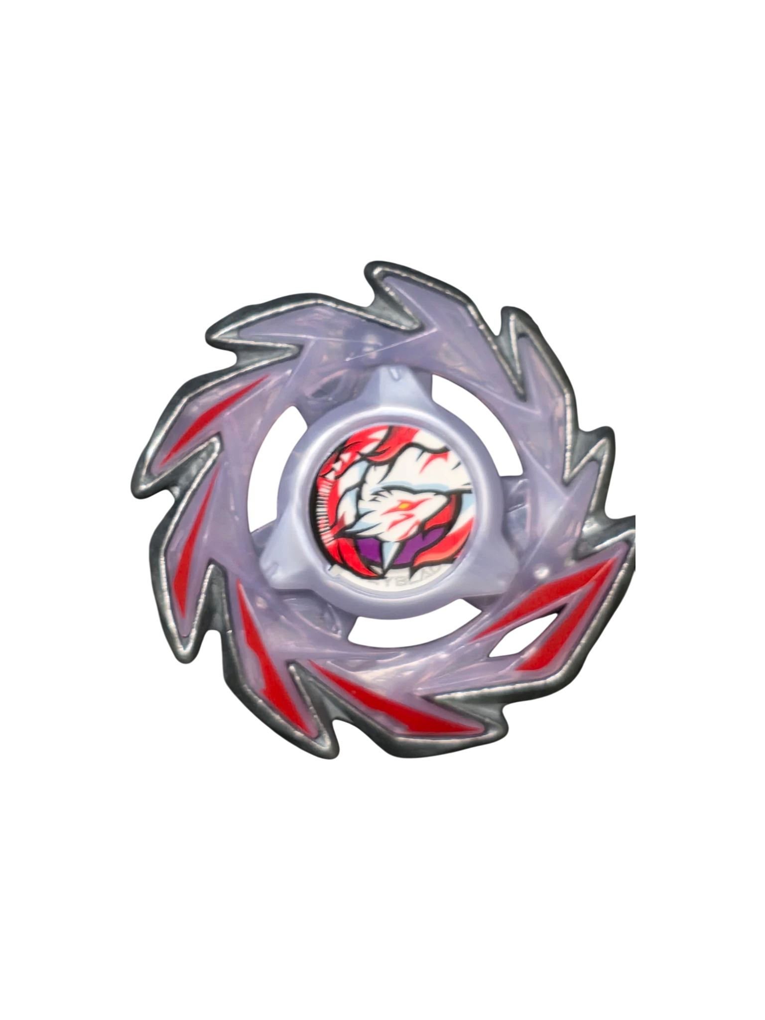 My Store Brush Fox Beyblade X main blade and lock chip in translucent purple with red accents on bubble wrap.