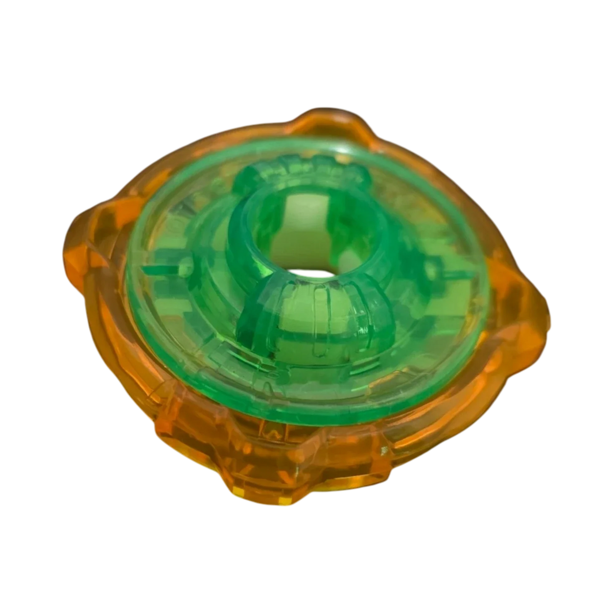 My Store authentic Hasbro Beyblade X 4-60 Ratchet part in translucent green and orange plastic.